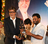 Resul Pukootty is ecstatic as he hugs Amitabh Bachchan who later gave him an award for his contribution to sound industry on behalf of Western India Motion Pictures & TV sound engineers association in Mumbai.