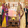 PM Modi distributing RuPay Cards under PMJDY by the IDFC Bank